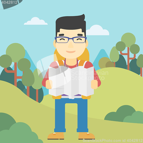 Image of Traveler with backpack looking at map.