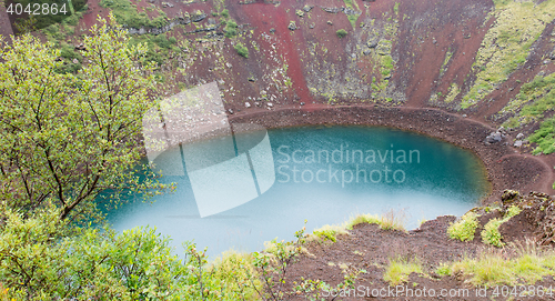 Image of Kerid is a crater lake of a turquoise color - Iceland