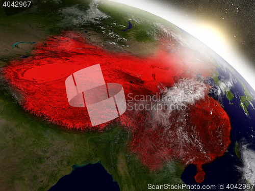 Image of China from space highlighted in red