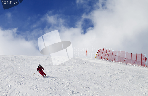 Image of Skier on ski slope at nice sun day