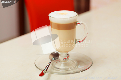 Image of coffee latte in glass cup on table