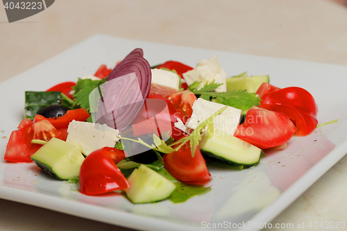 Image of fresh vegetable salad isolated on white background