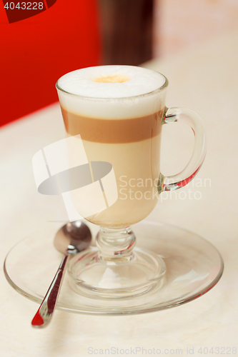 Image of coffee latte in glass cup on table
