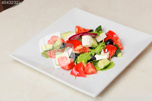 Image of fresh vegetable salad isolated on white background