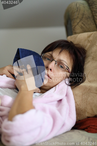 Image of woman at home after pulling teeth