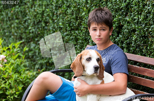 Image of Happy young Boy and his dog