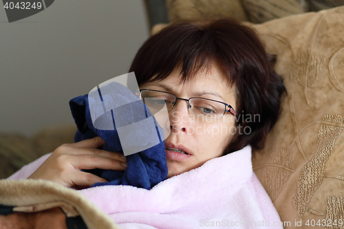 Image of woman at home after pulling teeth