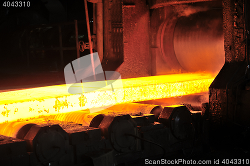 Image of hot steel plate on conveyor