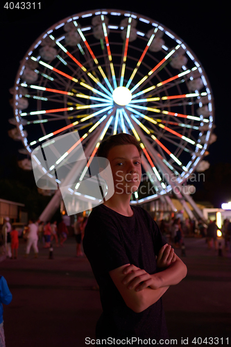 Image of Teen boy in amusement park