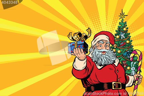 Image of Santa Claus Christmas tree and gift, copy space left