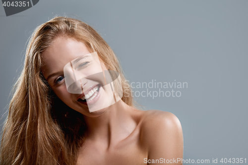 Image of Closeup of woman playfully winking at camera