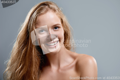 Image of Closeup of woman playfully winking at camera