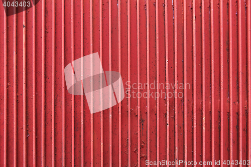 Image of close up of old painted metal ribbed surface