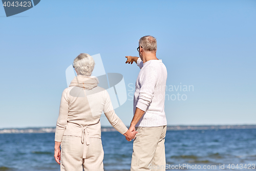 Image of happy senior couple on summer beach