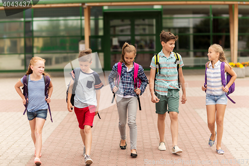 Image of group of happy elementary school students walking