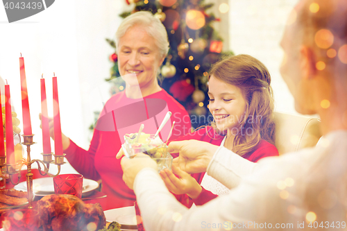 Image of smiling family having holiday dinner at home