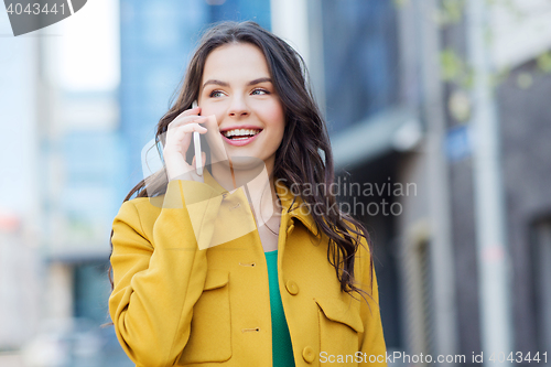 Image of smiling young woman or girl calling on smartphone