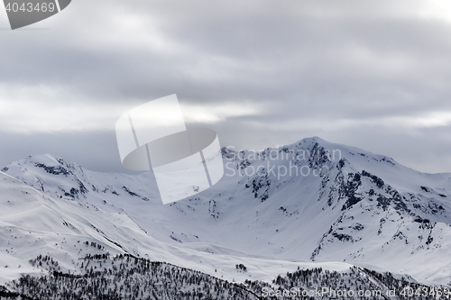 Image of Snow mountain in fog at gray morning