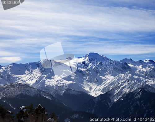 Image of Sunlight snowy mountains and cloudy sky