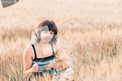 Image of beauty woman in barley field