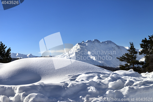 Image of Snowdrifts in winter mountain after snowfall at sun day