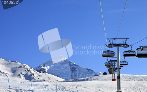 Image of Ski-lift at ski resort in sun cold morning