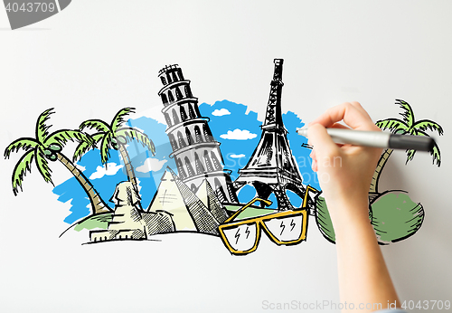 Image of close up of hand drawing touristic landmarks