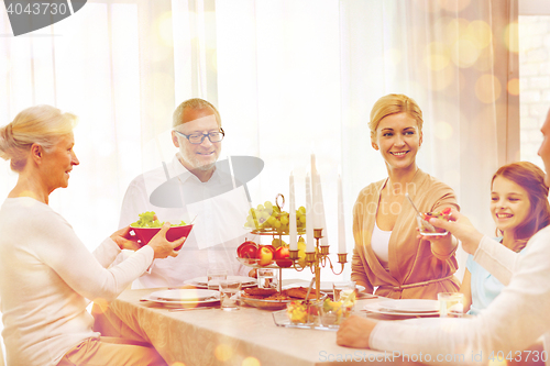 Image of smiling family having holiday dinner at home
