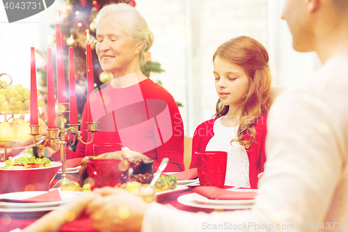 Image of smiling family having holiday dinner at home