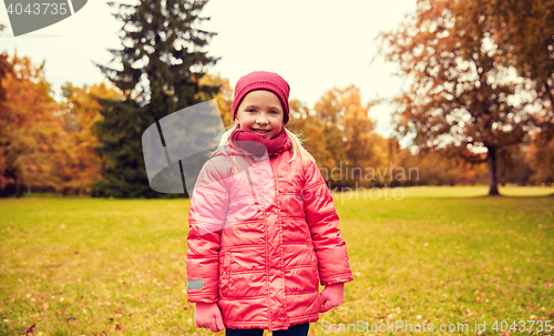 Image of happy little girl in autumn park