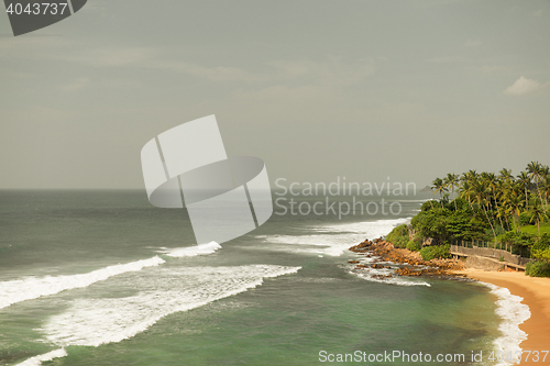 Image of sea or ocean waves and blue sky on Sri Lanka beach