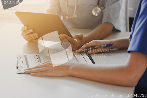 Image of close up of doctors with tablet pc at hospital