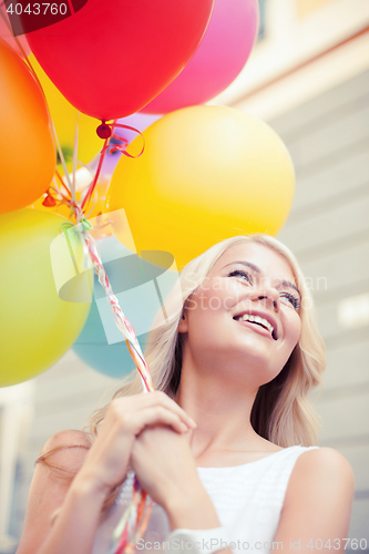 Image of woman with colorful balloons