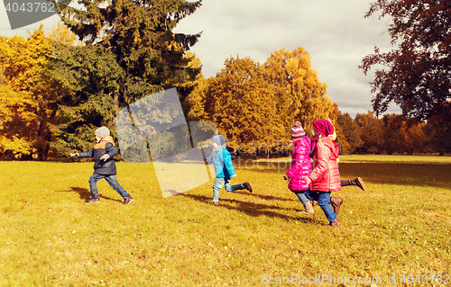 Image of group of happy little kids running outdoors