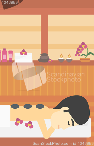 Image of Man getting stone therapy vector illustration.