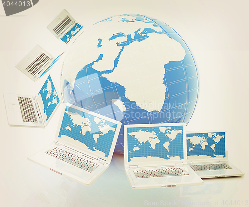 Image of Laptops around the planet earth . 3D illustration. Vintage style