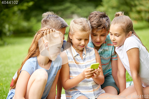 Image of kids or friends with smartphone in summer park