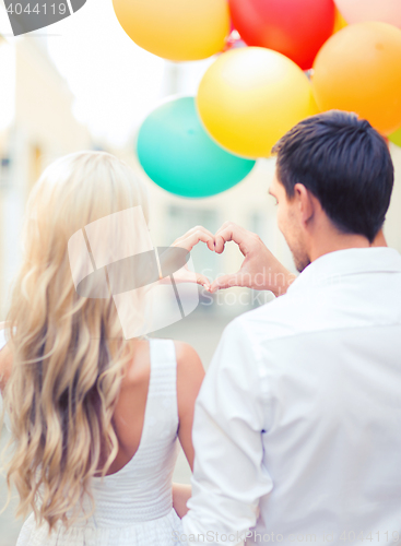 Image of couple with colorful balloons