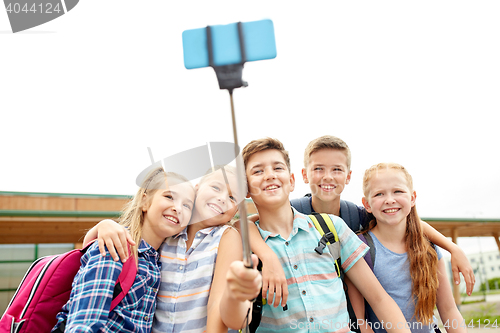 Image of happy elementary school students taking selfie