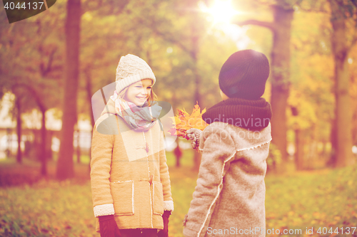 Image of smiling children in autumn park