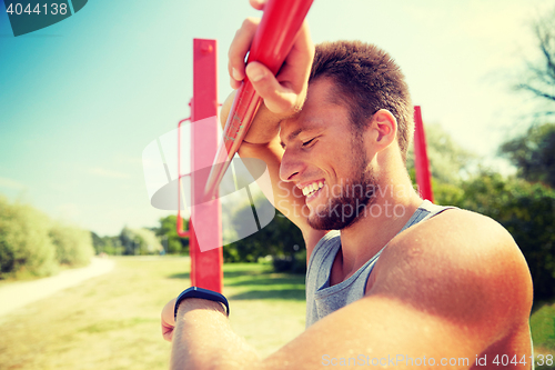Image of man with heart-rate watch exercising outdoors