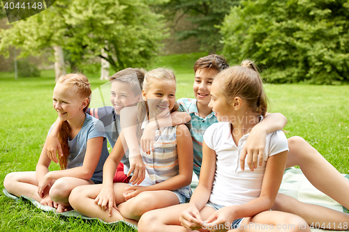 Image of group of happy kids or friends outdoors