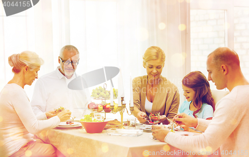 Image of smiling family having holiday dinner at home