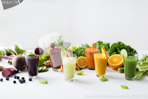 Image of glasses with different fruit or vegetable juices