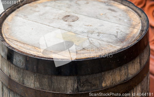 Image of close up of old wooden barrel table outdoors