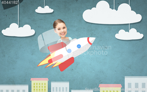 Image of teen girl flying on rocket above cartoon city