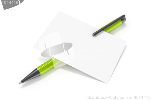 Image of a blank business card and a green ball pen
