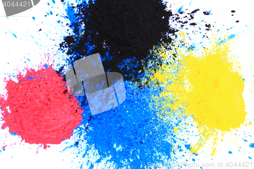 Image of cmyk toner powder (cyan, magenta, yellow, black)