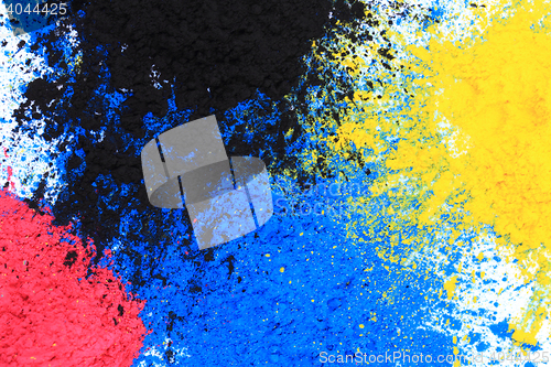 Image of cmyk toner powder (cyan, magenta, yellow, black)