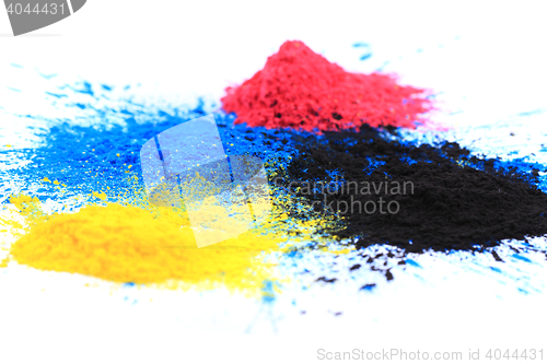 Image of cmyk toner powder (cyan, magenta, yellow, black)